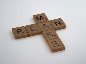 Scrabble pieces spelling out make plan